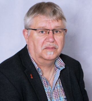 Heinz-Dieter Rode: Ein Mann mit kurzen grauen Haaren und einer Brille. Er trägt einen Bart.